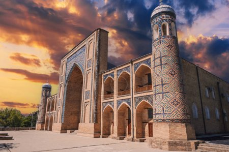 exterior of ancient Uzbek Islamic Kukeldash madrasah in Tashkent in Uzbekistan. Old madrasa in Asia on background of beautiful sunset sky