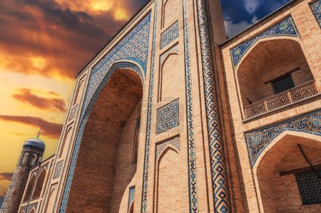portal of the ancient medieval Uzbek Islamic Kukeldash madrasah in Tashkent in Uzbekistan. Old madrasa in Asia at sunset