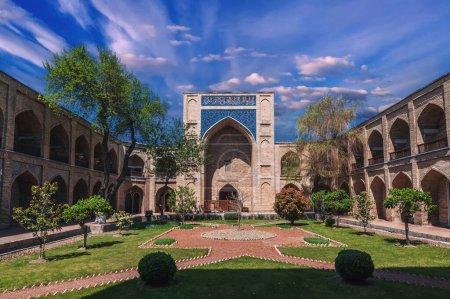 courtyard of ancient Uzbek Kukeldash Madrasah in Tashkent in Uzbekistan. Old medieval Islamic madrasa in Asia in summer