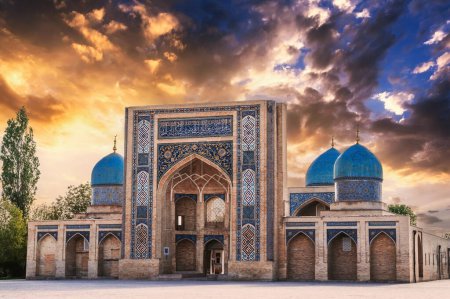 Photo for Ancient old Muslim Madrasah of Barak Khan at sunset in summer. Hazrati Imam Architectural Complex in Tashkent in Uzbekistan - Royalty Free Image
