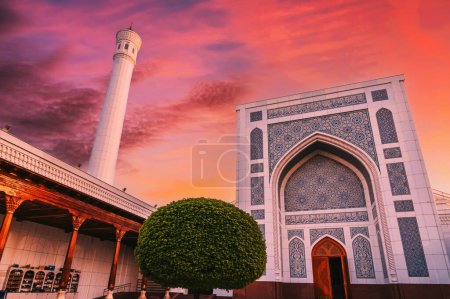 Photo for New Islamic Masjid Minor Mosque in Tashkent in Uzbekistan on background of the dramatic red sunset sky - Royalty Free Image