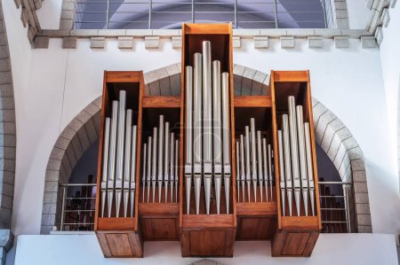 pipes of a church organ inside the interior of a Christian Catholic church. Cathedral of the Sacred Heart of Jesus in Tashkent in Uzbekistan