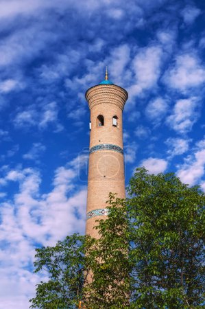 ancient old minaret of Khast Imom mosque on background at blue sky in summer. Islamic architectural complex Hazrati Imam in Tashkent in Uzbekistan