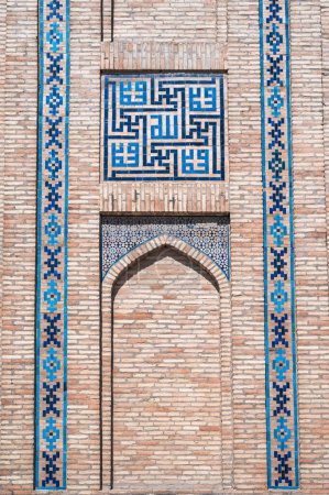 traditional Arabic Uzbek ceramic tile patterns on brick wall of the ancient Muslim Islamic Kukeldash Madrasah in Tashkent in Uzbekistan