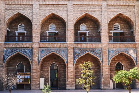 Cells of students in the courtyard of ancient educational Islamic madrasah Kukeldash in Tashkent in Uzbekistan