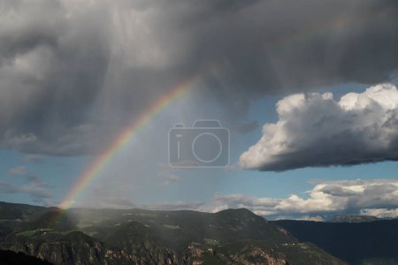 Photo for Rainbow in a cloudy sky in the mountains of South Tyrol - Royalty Free Image