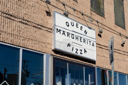 Photo for Toronto, Canada - November 28, 2020: Queen Margherita Pizza restaurant sign on the wall in downtown Toronto, Canada. Queen Margherita Pizza is named for Margherita Maria Teresa Giovanna. - Royalty Free Image