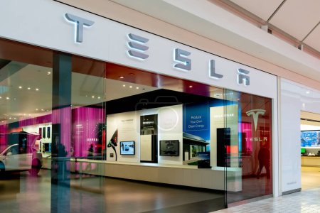Photo for Tysons Corner, Virginia, USA- January 14, 2020: Tesla storefront in the Tysons Corner Center in Virginia, USA. Tesla, Inc. is an American electric vehicle and clean energy company. - Royalty Free Image