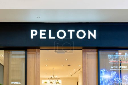 Photo for Tysons Corner, Virginia, USA- January 14, 2020: Peloton store sign in Tysons Corner, Virginia. Peloton is a New York City based exercise equipment and media company. - Royalty Free Image