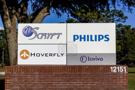 Photo for Orlando, Florida, USA- February 8, 2020: The company signs (Scrypt, Hoverfly, Philips, Invivo) on the signage outside the office building in Orlando, Florida, USA. - Royalty Free Image