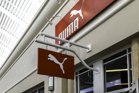 Photo for Orlando, Florida, USA- February 24, 2020: PUMA hanging sign outside the store in Orlando, Florida, USA, a German company designs and manufactures athletic and casual footwear, apparel and accessories - Royalty Free Image