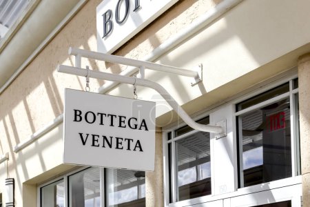 Photo for Orlando, Florida, USA- February 24, 2020: Bottega Veneta hanging sign outside the store in Orlando, Florida, USA. Bottega Veneta is an Italian luxury goods and high fashion brand. - Royalty Free Image