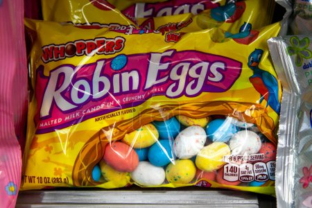 Photo for Pennsylvania, New York, USA - March 2, 2020: Hershey's Whoppers LARGE Robin Eggs Malted Milk candy with a Crunchy Shell bags on the shelf in a store. Hershey is an American chocolate manufacturer. - Royalty Free Image