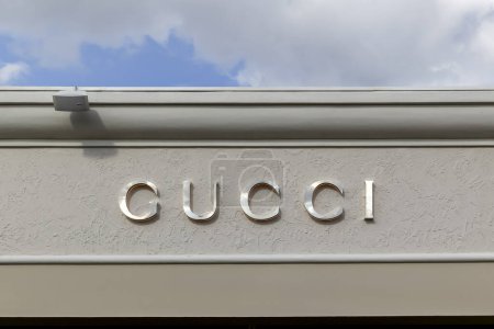 Photo for Orlando, Florida, USA- February 24, 2020: Gucci store sign on the building in Orlando, Florida, USA; Gucci is an Italian luxury brand of fashion and leather goods. - Royalty Free Image