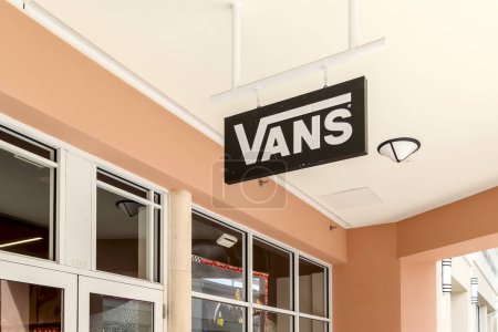 Photo for Orlando, Florida, USA- February 24, 2020: Vans store sign hanging outside the store in Orlando, Florida, USA; Vans is an American manufacturer of skateboarding shoes and related apparel. - Royalty Free Image