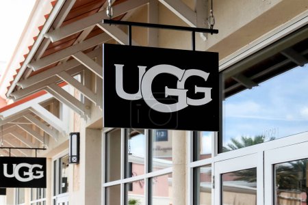Photo for Orlando, Florida, USA- February 24, 2020: Close up of a UGG store sign in Orlando, Florida, USA. UGG (formerly UGG Australia) is an American footwear company and a division of Deckers Brands. - Royalty Free Image