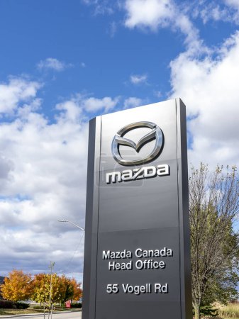 Photo for Richmond Hill, Ontario, Canada - October 14, 2019Mazda pylon sign with blue sky in background outside a dealership in Richmond Hill. Mazda Motor Corporation is a Japanese automaker. - Royalty Free Image