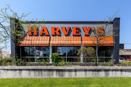 Photo for Toronto, Canada - May 17, 2018: Sign of Harvey's on exterior wall. Harvey's is a fast food restaurant chain that operates in Canada. - Royalty Free Image
