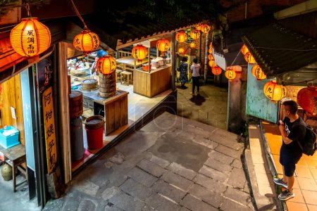 Photo for Jiufen, New Taipei City, Taiwan - November 16, 2018: Night view of Jiufen (Chiufen) Old Street. Located in New Taipei City, Jiufen old street is full of local snack vendors and special accessory store - Royalty Free Image
