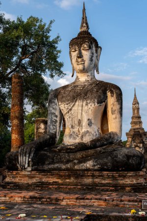 Photo for Buddha Statue in the morning at wat mahathat in Sukhothai Historical Park, Thailand, one of Thailand's most impressive World Heritage Sites, includes the remains of 21 historical sites. - Royalty Free Image