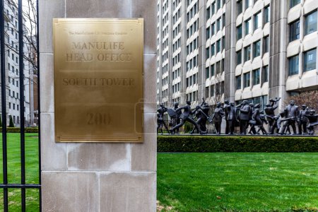 Photo for Toronto, On, Canada - May 5, 2018: sign and Sculpture with the Manulife head office building in the background in Toronto. Manulife is a Canadian multinational insurance company. - Royalty Free Image