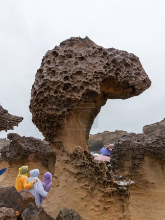 Photo for Mushroom Rocks at Yehliu Geopark in Taiwan.The mushroom rocks are formed with globe-shape rocks on the top while supporting by the thin stone pillars on the bottom. - Royalty Free Image