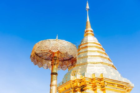 Photo for Roof of the central golden stupa with blue sky in background at Wat Phra That Doi Suthep, Chiang Mai, Thailand, a Theravada Buddhist temple (wat) in Chiang Mai Province - Royalty Free Image