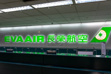 Photo for Taoyuan, Taiwan - December 10, 2018: EVA Air sign at the counter in Taoyuan International Airport near Taipei. EVA Air is a Taiwanese international airline. - Royalty Free Image
