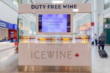 Photo for Toronto, Canada- March 28, 2018: Duty free icewine store in Toronto Pearson Airport. Icewine is a type of dessert wine produced from grapes that have been frozen while still on the vine. - Royalty Free Image