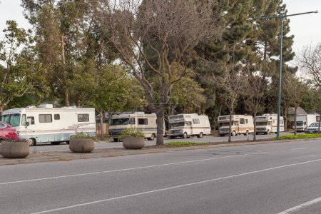 Photo for Mountain View, California, USA - March 30, 2018: People living in the RV parked on the side of the road in Mountain View, California. - Royalty Free Image