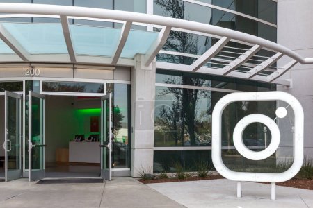 Photo for Menlo Park, California, USA - March 30, 2018: Instagram logo at front door of headquarters in Silicon Valley. Instagram is a photo and video-sharing social networking service owned by Facebook, Inc. - Royalty Free Image