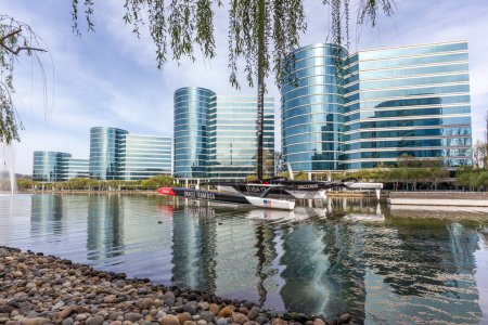 Photo for Redwood Shores, California, USA - March 30, 2018: Buildings and lake at Oracle 's headquarters in Silicon Valley. Oracle Corporation is an American multinational computer technology corporation. - Royalty Free Image