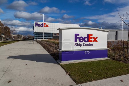 Photo for TORONTO, CANADA - NOVEMBER 19, 2017: FedEx logo on the building of FedEx Ship Centre in Toronto. FedEx Corporation is an American multinational courier delivery services company - Royalty Free Image