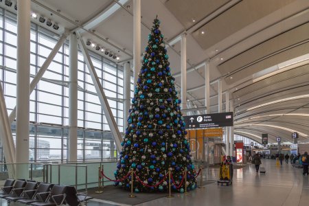 Photo for TORONTO, CANADA - DECEMBER 11: Christmas tree lighting up in Pearson Airport on December 11, 2016 in Toronto. Pearson Airport is the largest and busiest airport in Canada - Royalty Free Image