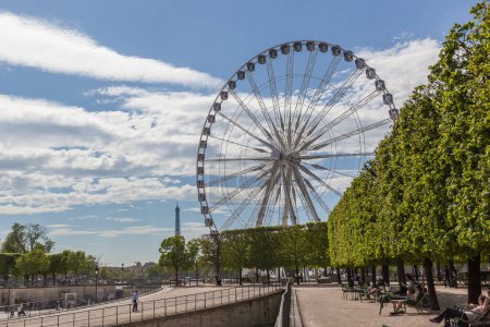 Photo for PARIS, FRANCE- MAY 7, 2016: Ferris wheel and Egyptian obelisk in Place de la Concorde in Paris. - Royalty Free Image