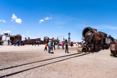 Photo for Uyuni, Bolivia - February 21, 2023: The train cemetery in Uyuni, Bolivia. Train cemetery is home to dozens of skeletons of locomotives from the golden era of mining. - Royalty Free Image