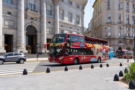 Photo for Buenos Aires, Argentina - January 17, 2023: Tourists sightseeing on a double decker tour bus in downtown Buenos Aires, Argentina. - Royalty Free Image