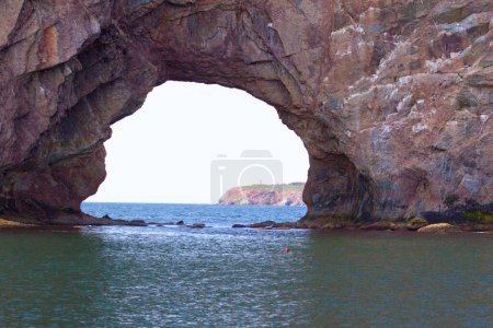 Perce Rock, Perce, Gaspe, Peninsula, Quebec, Canada Perce Rock is one of the world's largest natural arches located in water.