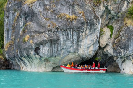 Photo for Puerto Rio Tranquilo, Chile - February 14, 2023: Tourists taking boat tours to Marble Caves (Marble Cathedral), Puerto Rio Tranquilo, Chile. The Marble Caves is a sculpture hewn by the crashing waves - Royalty Free Image