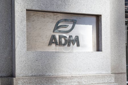 Photo for Chicago, Illinois, USA - March 28, 2022: ADM logo displayed at the entrance to its headquarters in Chicago. ADM is an American multinational food processing and commodities trading corporation. - Royalty Free Image