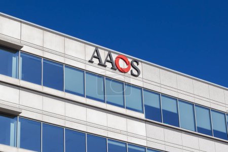 Photo for Rosemont, Illinois, USA - March 27, 2022: AAOS sign on their headquarters building in Rosemont, Illinois. The American Academy of Orthopaedic Surgeons is an orthopedic organization. - Royalty Free Image