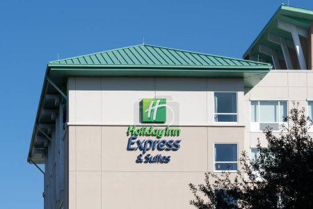 Photo for Orlando, Fl, USA - January 6, 2022: A close up of Holiday Inn Express and Suites sign on the building. Holiday Inn is an American hospitality of hotel and a brand of InterContinental Hotels Group. - Royalty Free Image