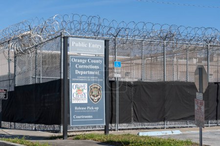 Photo for Orlando, Florida, USA - January 20, 2022: Orange County Corrections Department sign outside of perimeter chain link security fence, a full-service detention facility. - Royalty Free Image