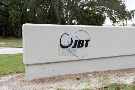 Photo for Orlando, Fl, USA - January 5, 2022: JBT logo sign at their headquarters in Orlando, Fl, USA. JBT AeroTech provides ground support and gate equipment to airports and the military. - Royalty Free Image