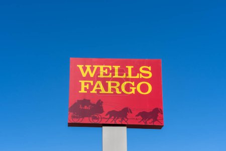 Photo for Orlando, Florida, USA - January 30, 2022: Wells Fargo pole sign with blue sky in background. Wells Fargo and Company is an American multinational financial services company. - Royalty Free Image