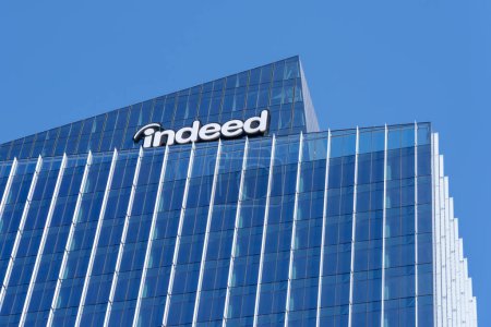 Photo for Austin, Texas, USA - March 18, 2022: Closeup of Indeed logo sign on its headquarters building in Austin, Texas, USA. Indeed is an American worldwide employment website for job listings. - Royalty Free Image