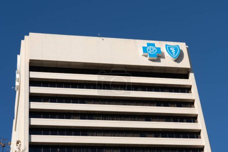 Photo for Detroit, MI, USA - December 26, 2021: Blue Cross Blue Shield logo sign on the building. Blue Cross Blue Shield Association is a federation of 35 separate United States health insurance companies. - Royalty Free Image