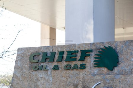 Photo for Dallas, Texas, USA - March 20, 2022: The closeup sign for Chief Oil and Gas at its headquarters in Dallas, Texas, USA, a private EP company primarily focused on the Marcellus Shale. - Royalty Free Image