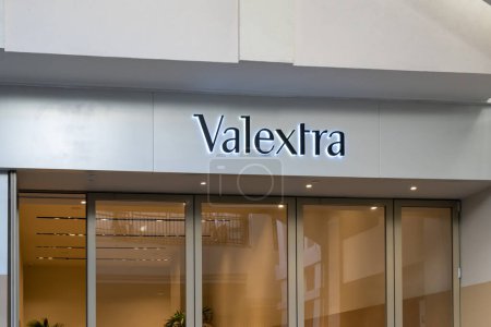 Photo for Honolulu, HI, USA - January 14, 2024: Close-up of the Valextra logo sign at their store in a shopping mall in Waikiki, Hawaii. Valextra is a brand of luxury leather goods and accessories. - Royalty Free Image