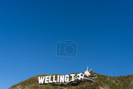 Photo for Wellington, New Zealand - February 11, 2024: A giant football in place on the Wellington blown away sign at the city's airport in Wellington, New Zealand. - Royalty Free Image